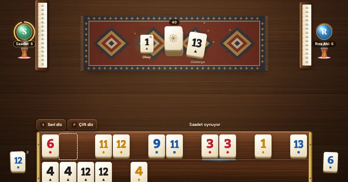 A hand of Okey in Taşivo: tiles arranged on the rack, the indicator and the okey in the middle